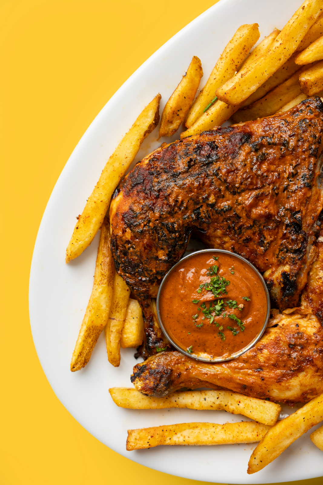 Flame-grilled chicken with peri peri fries